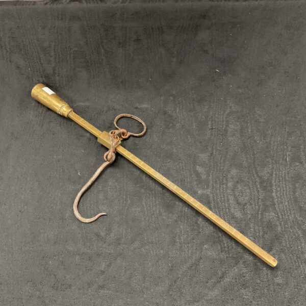 Antique 19th-century brass beam scale with sliding weight.