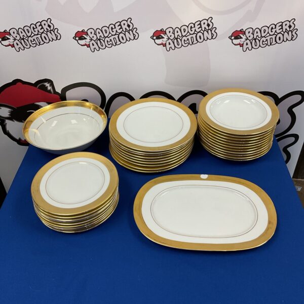 Vintage Heinrich Winterling Bavarian china plates and bowls with gold trim.