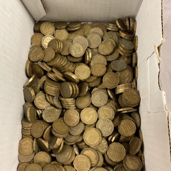 Large quantity of brass British Threepenny Bit coins for collectors.