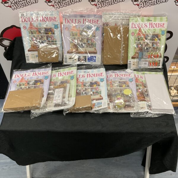 Sealed bags of Disney dollhouse accessories and furniture.
