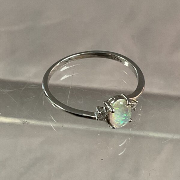 Silver ring with opal gemstone, size T.