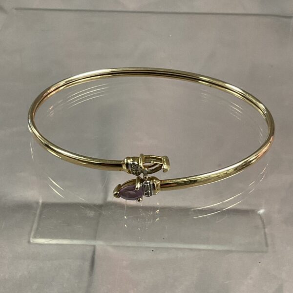 9ct gold bracelet with diamonds and amethyst gemstones.