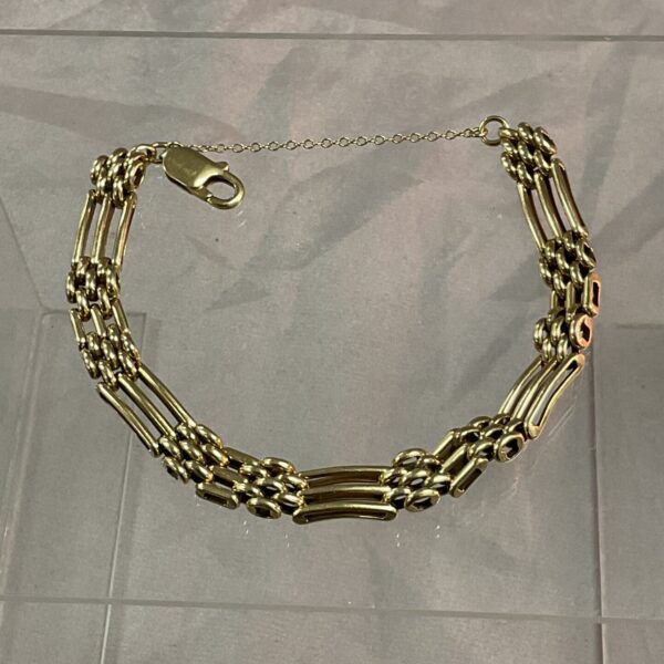 Vintage 9ct gold gate bracelet with three-bar links.
