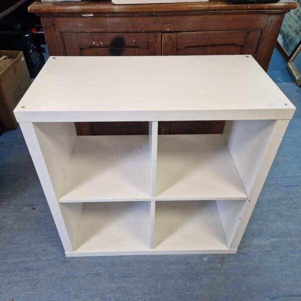 White Ikea cube shelving unit for storage and display.