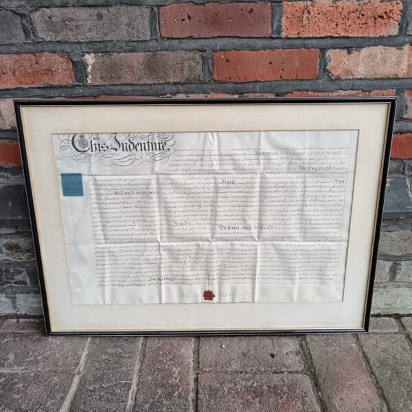 Antique indenture document with detailed handwriting and wax seal.