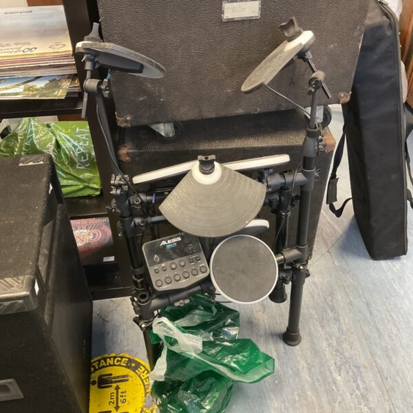 Alesis DMLite electric drum kit with drum pads and module.