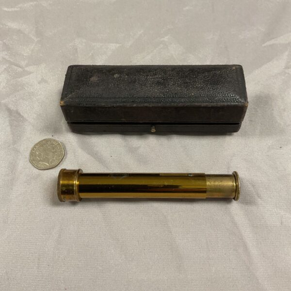 Antique brass spectroscope with a vintage case, scientific instrument.