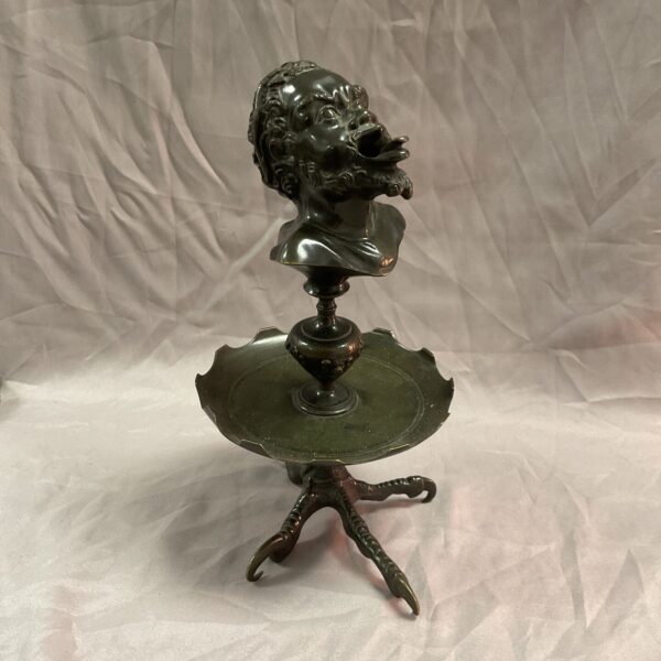 Antique bronze satyr oil lamp with eagle talon base.