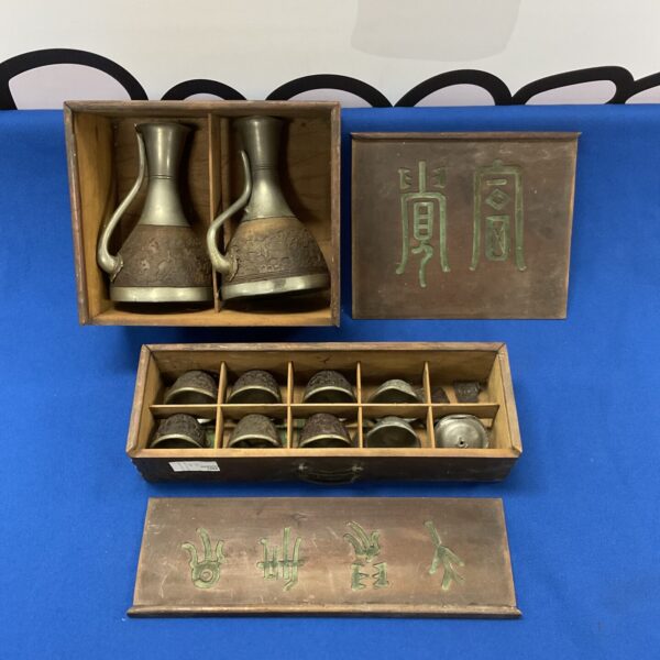 Antique Chinese coconut decanter set with carved details.