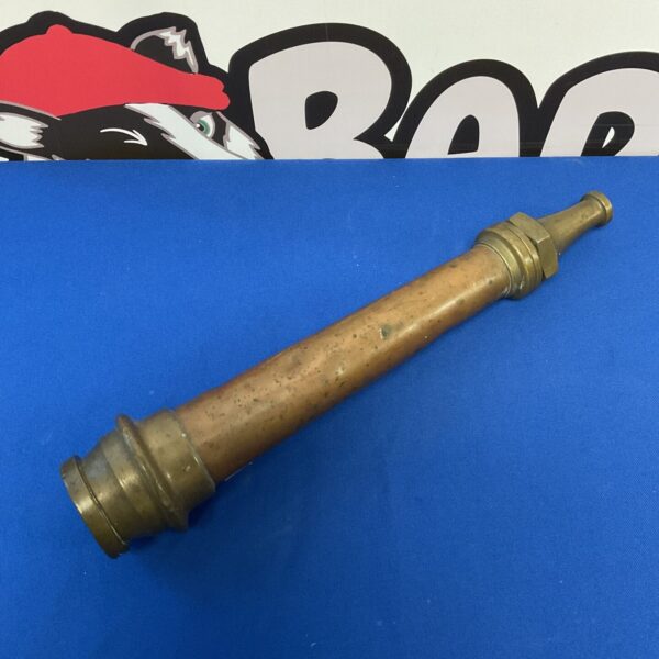 Antique copper and brass fire hose nozzle, vintage fire fighting equipment.
