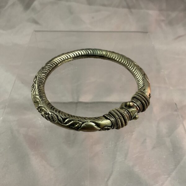 Antique Indian silver bracelet with intricate detailing.