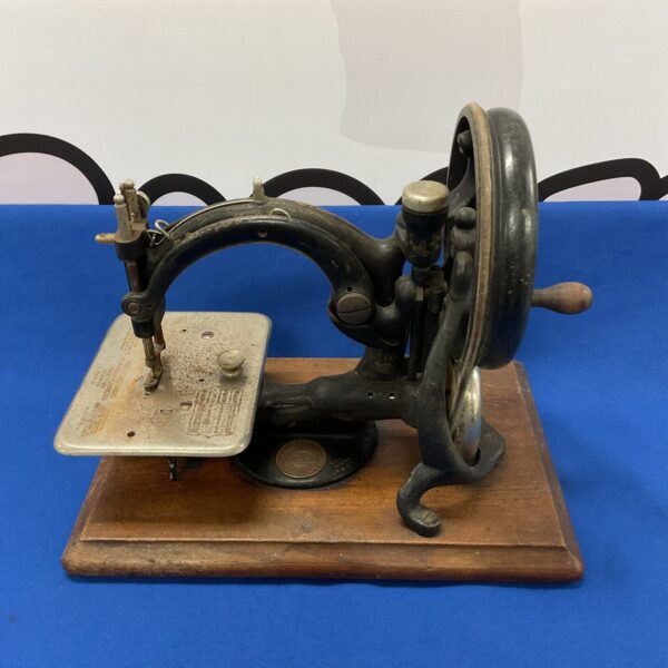 Antique Wilcox & Gibbs sewing machine, Victorian era collectible.