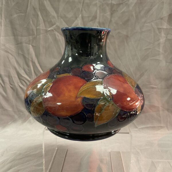 Antique Moorcroft vase with pomegranate design, front view.