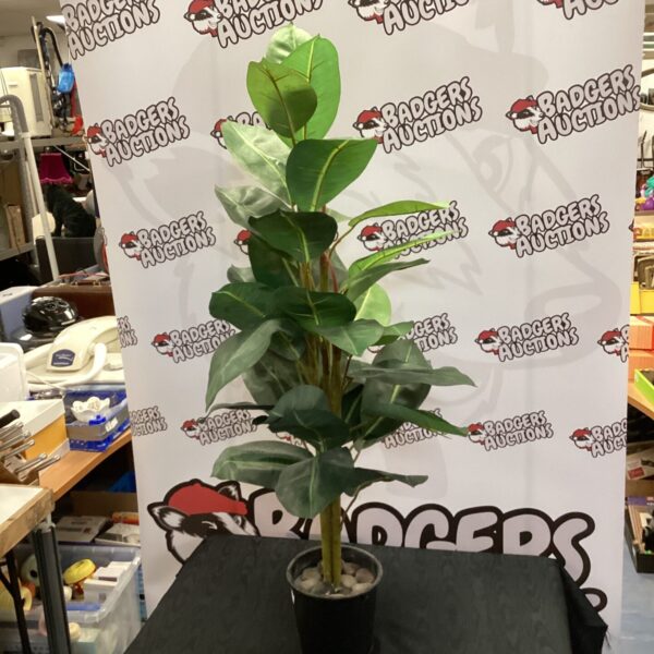 Realistic artificial potted plant in a black pot for home decor.
