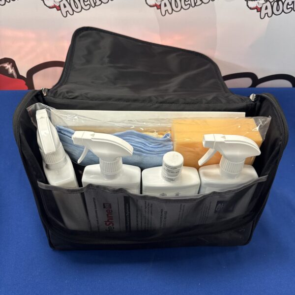 Autoglym Lifeshine car valet set with cleaning products and microfibre cloth.