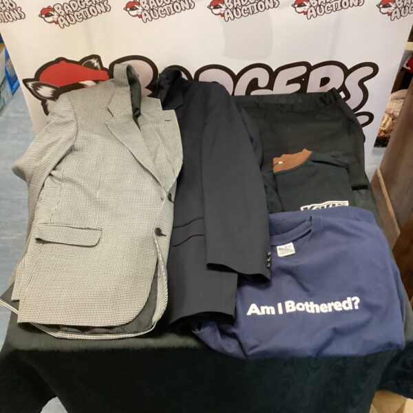 Mixed lot of men's clothing including suit jackets and a Vans sweater.