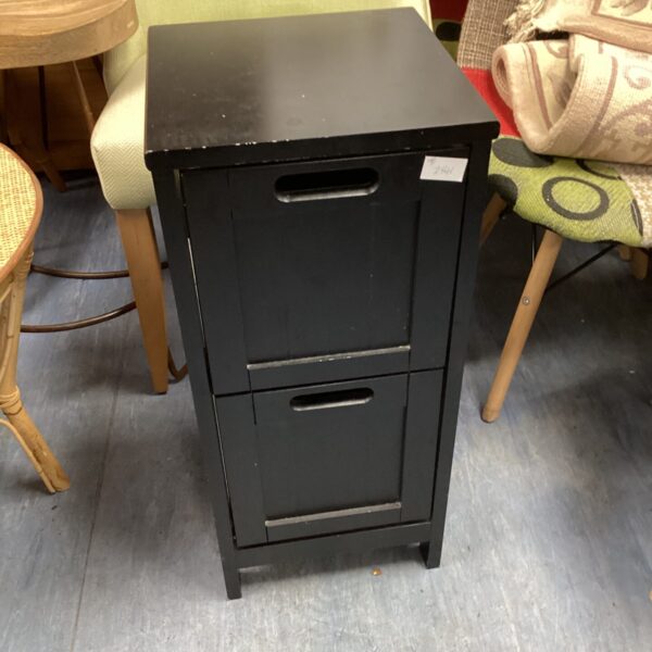 Small white bathroom cabinet with two drawers for storage.