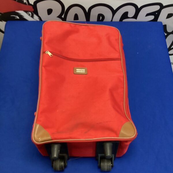 Vintage Beaugency red wheeled travel bag for collectors.
