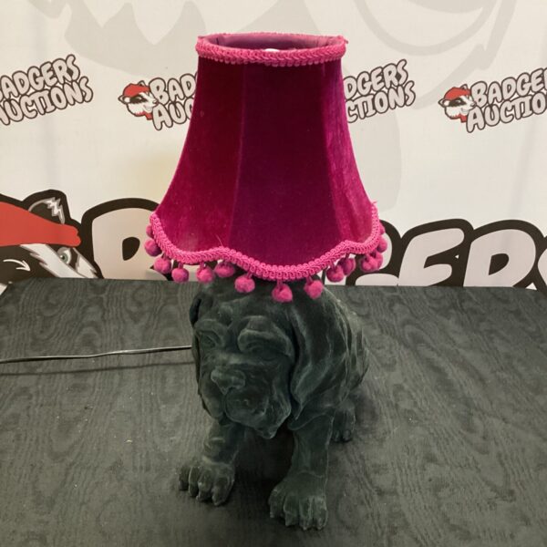 Vintage black dog table lamp with red shade.