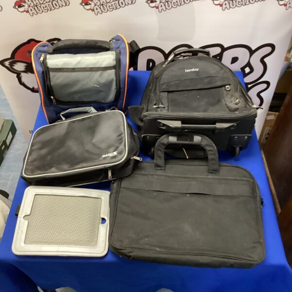 Mixed lot of bags and a tablet case for travel and storage.