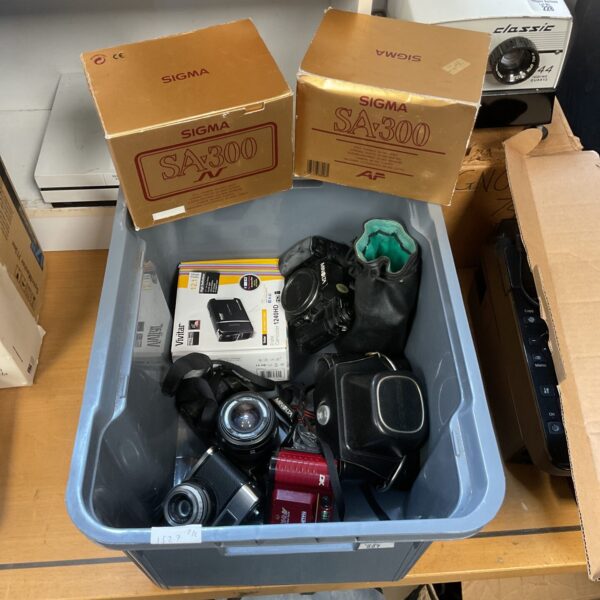 Vintage camera lot including Minolta and Halina cameras for collectors.