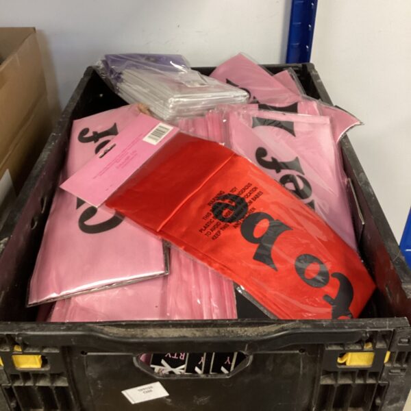Pink hen party sashes in plastic packaging, wedding accessories.