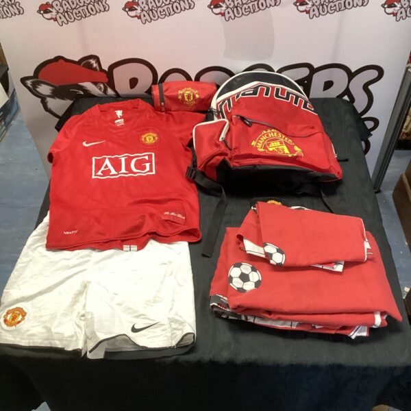 Manchester United kit bundle including shirt, shorts, rucksack and duvet.