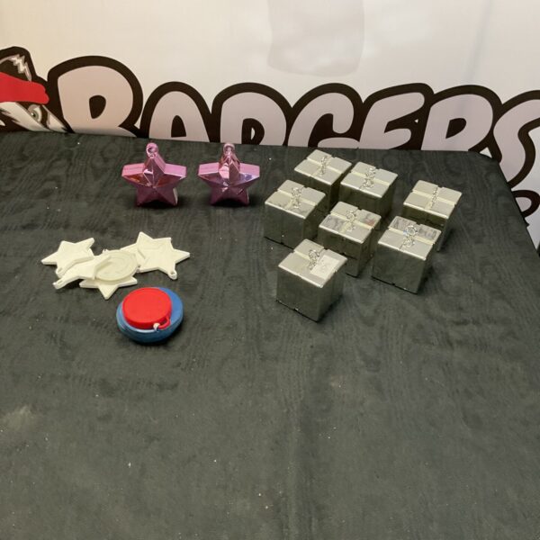 Colorful assortment of balloon weights for parties and events.