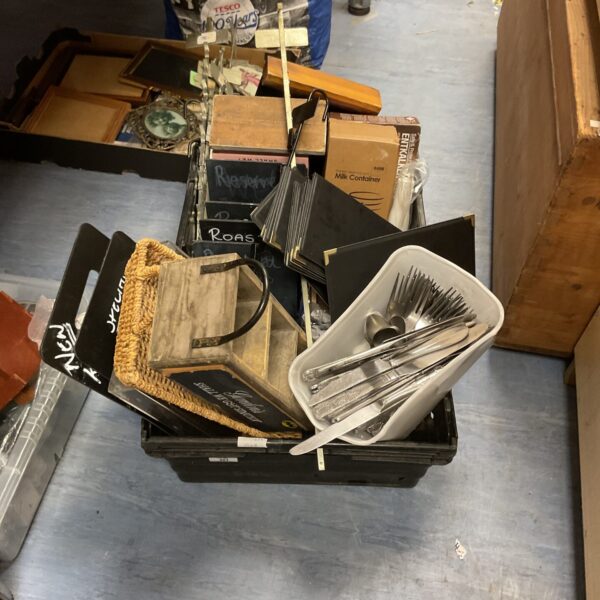 Mixed lot of coffee, cutlery, and kitchen items on display.