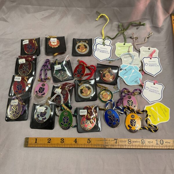 Collection of vintage Henley Regatta membership tags and badges.