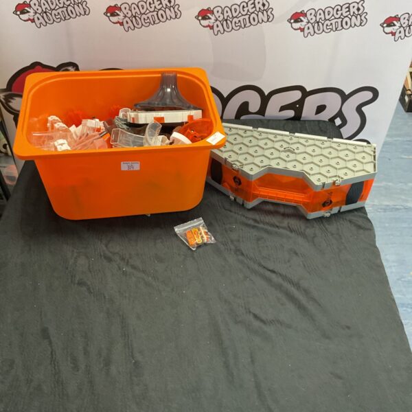 A box of mixed Hexbug playsets and robotic insect toys.