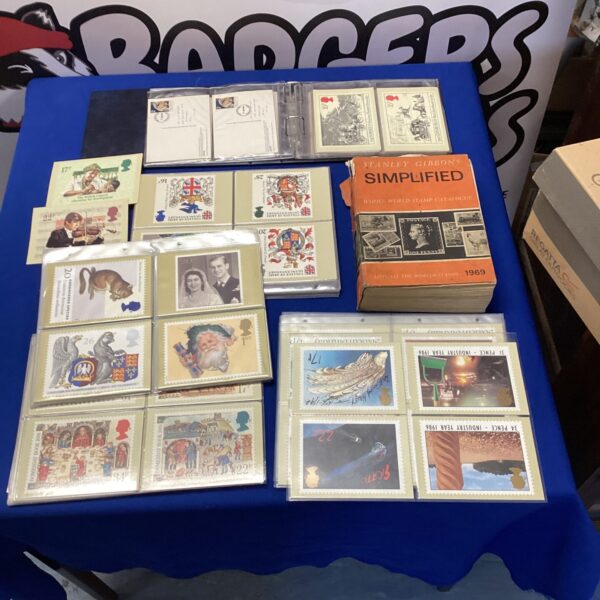 Vintage stamp collection with Stanley Gibbons book for collectors.
