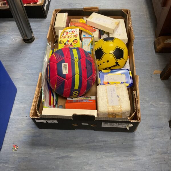 Mixed toy lot with footballs, magic tricks and prank toys.