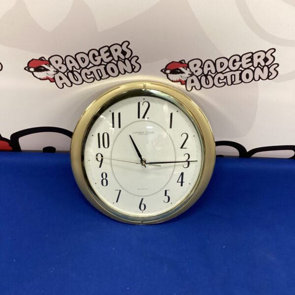 Vintage brass effect oval London Clock for wall mounting.