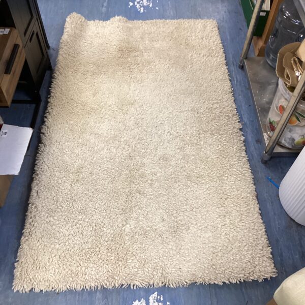 Vintage Brink & Chapman shag pile rug, textured and retro style.