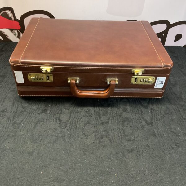 Front view of a vintage brown leather briefcase.