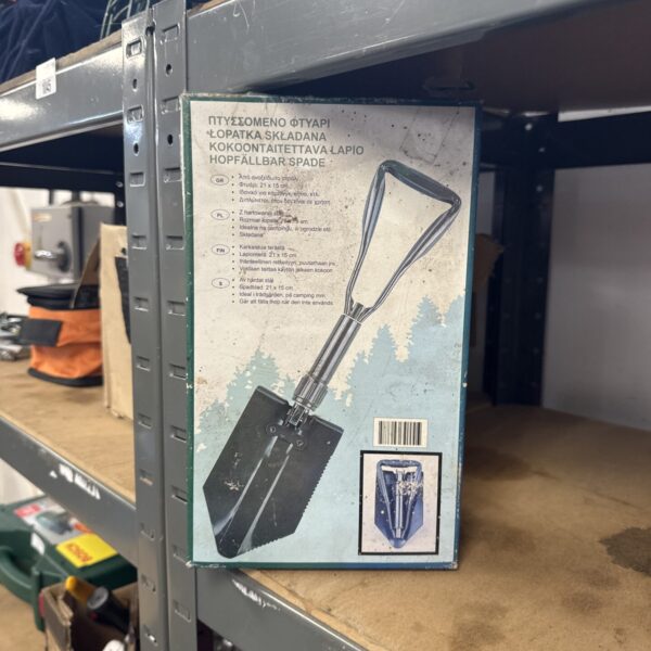 Vintage camping folding spade H6102, showing signs of wear.