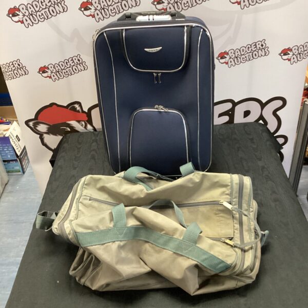 Dark blue vintage Carlton International travel holdall and wheeled bag set.