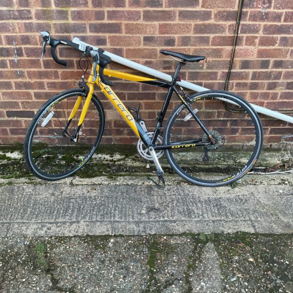 Yellow Carrera TDE SE road bike for sale.