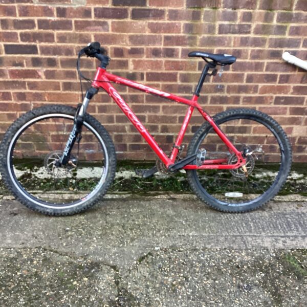Red Carrera Vulcan mountain bike for sale.