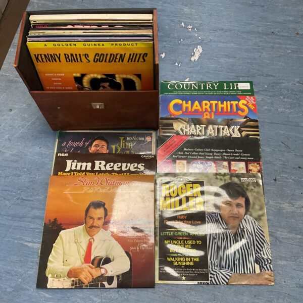 Vintage vinyl record lot with colourful album covers.