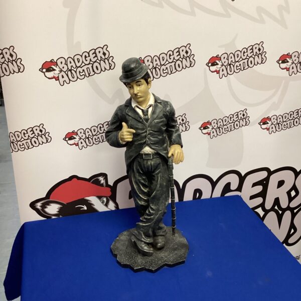 Detailed resin Charlie Chaplin figure in classic Tramp attire.