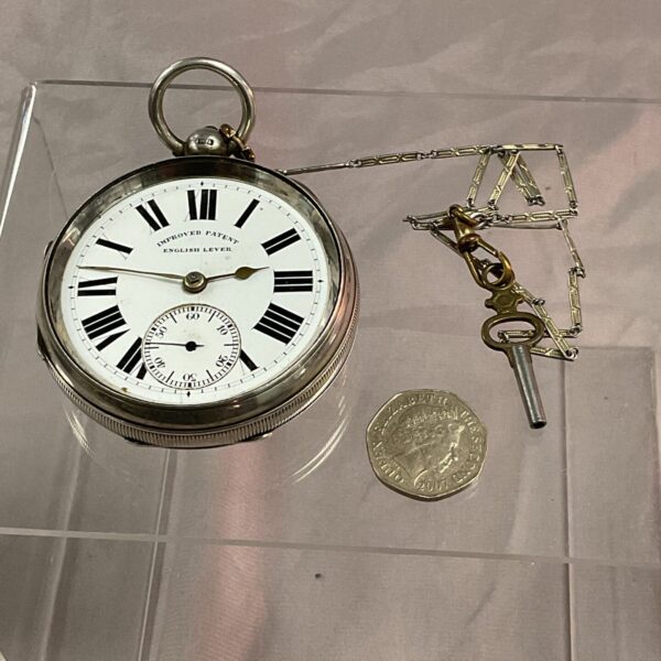 Antique silver pocket watch with Roman numeral dial and Chester hallmark.