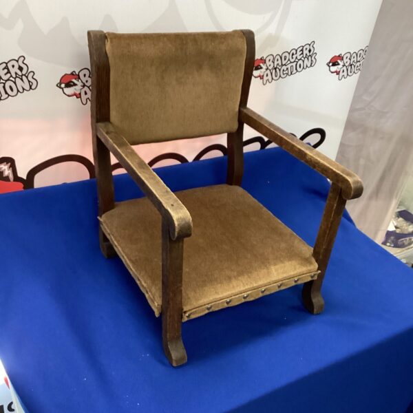 Vintage childs armchair with padded seat and back.