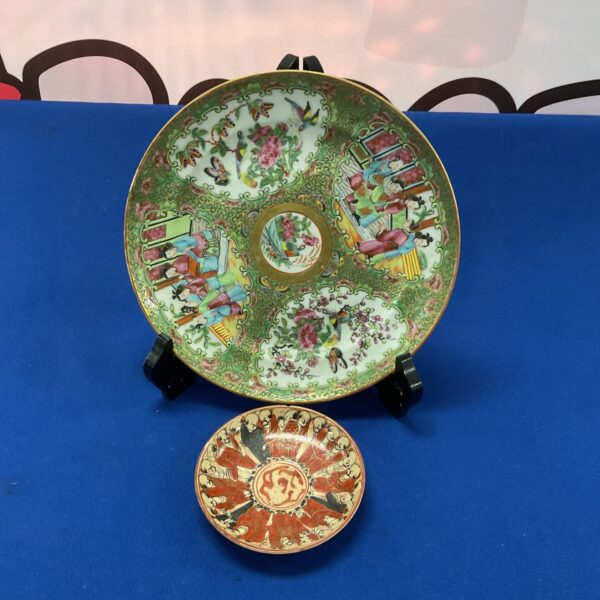 Antique Famile Rose plate with vibrant Qing Dynasty design.