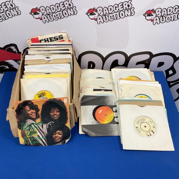 Collection of vintage 7” soul vinyl records in a cardboard box.