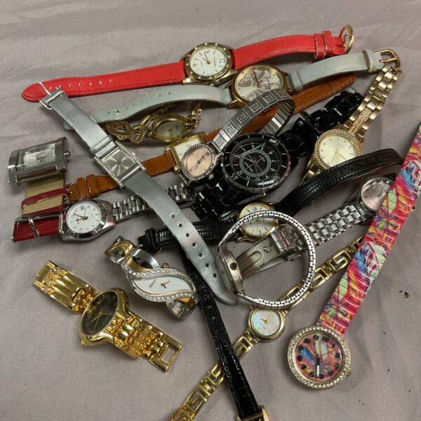 Assorted vintage wristwatches in a collection, ideal for repair.