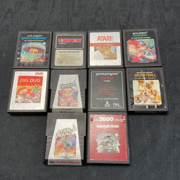 Vintage Atari 2600 games lot with various cartridges for retro gaming.
