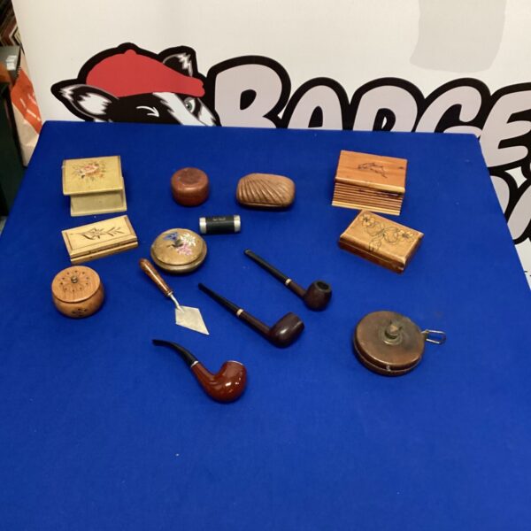 Vintage collectible lot with wooden boxes, pipes, and tape measure.