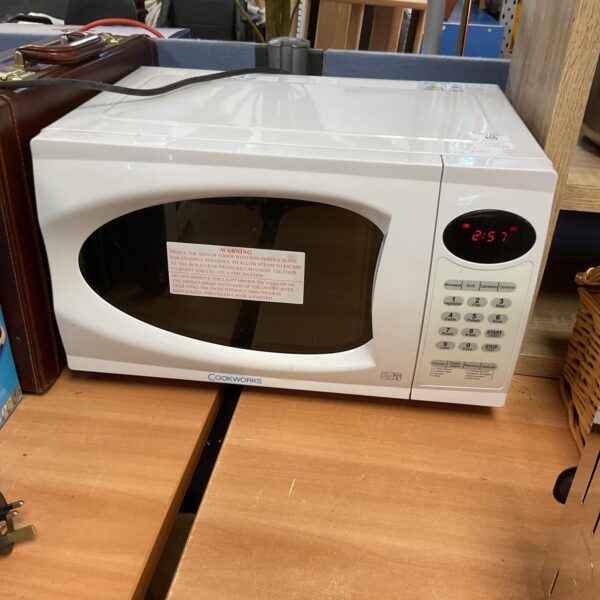 White Cookworks countertop microwave, kitchen appliance for reheating food.